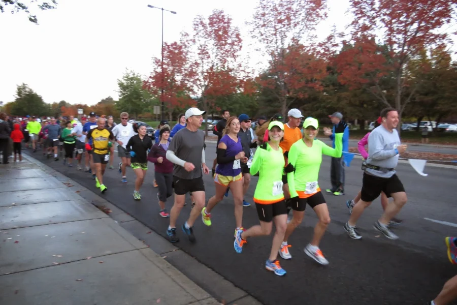 Runners on a tree-lined Boise street during the City of Trees Marathon Runners on a tree-lined Boise street during the City of Trees Marathon